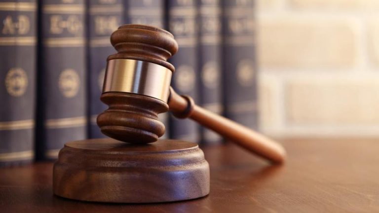 gavel-leaning-against-books-row-of-law_fbc3878c-9967-11e8-86f4-8f26f26dd985